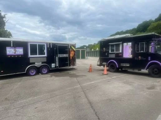 Foxy Fran's catering trailer and food truck parked side by side